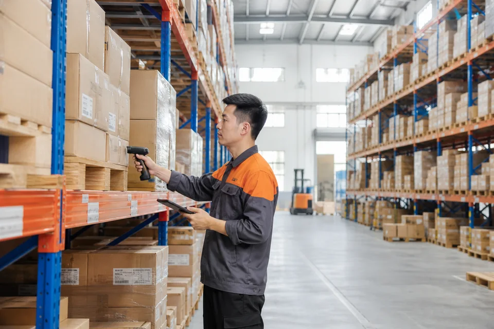 SFC staff scanning inventory in a China fulfillment warehouse